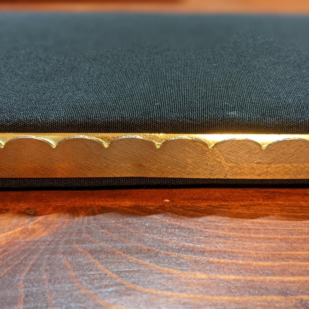 Black & Gold Vintage clutch, strapless kiss lock fold. Contrast red interior.